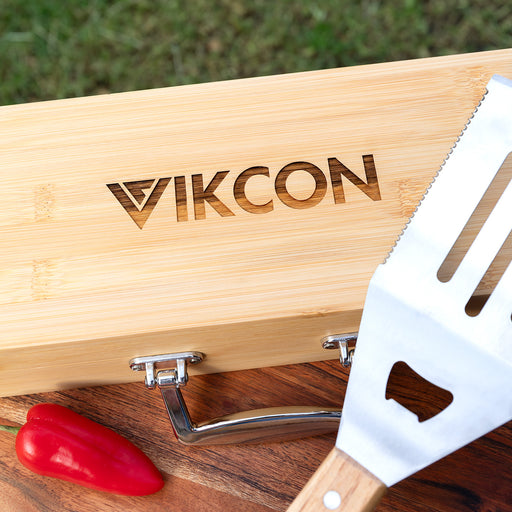 Premium stainless steel BBQ utensils in engraved bamboo case for client giftin