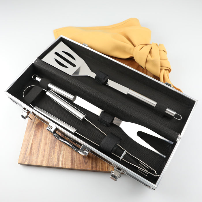 Luxury three-piece BBQ set with spatula, tongs, and fork in engraved aluminium carry case
