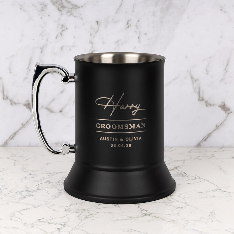 Personalised matte black beer mug engraved with name, wedding role and details.