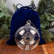 Personalised glass bauble presented in a blue velvet bag and kraft gift box