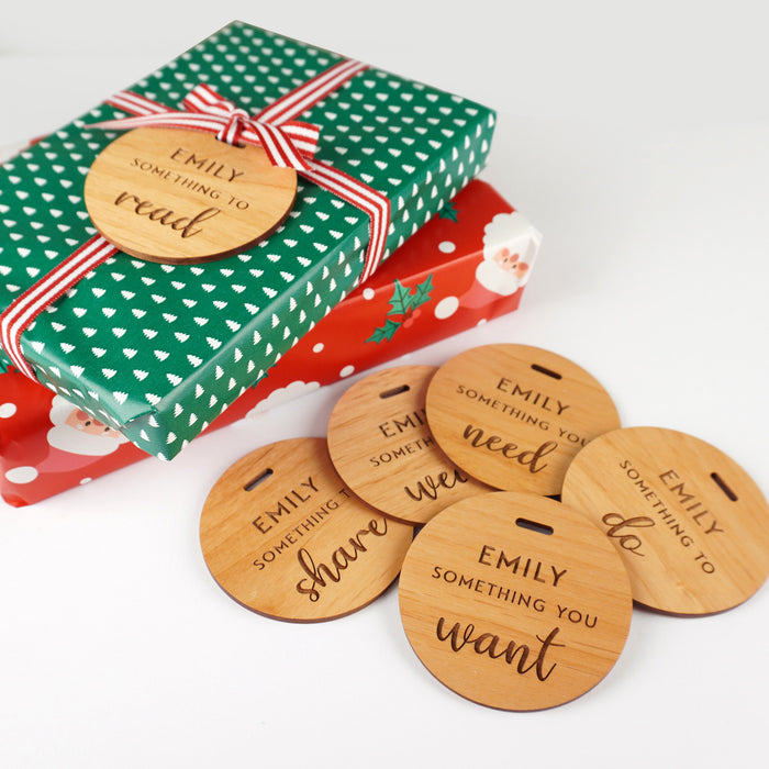 Reusable round wood Christmas gift tags customised with child’s name