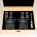 Branded whiskey gift set with company logo engraving on premium glassware, complete with reusable stones and accessories for client gifting.