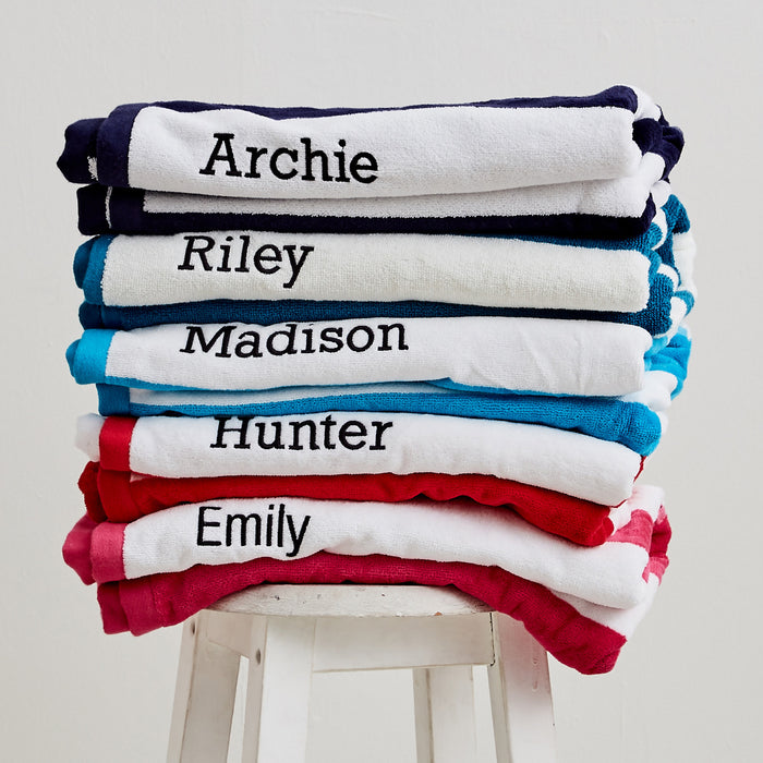 Set of personalised striped towels - each embroidered with a child’s name for a unique Christmas gift