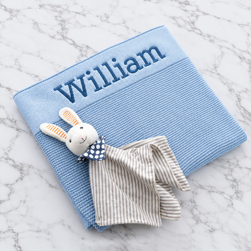 Personalised baby blue knitted blanket embroidered with name