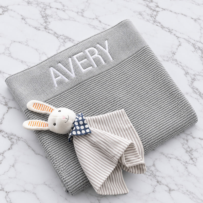 Personalised grey knitted baby blanket embroidered with name