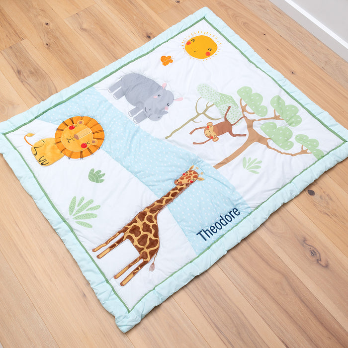 Personalised safari baby blanket with embroidered name featuring lion, giraffe, hippo, and monkey design.