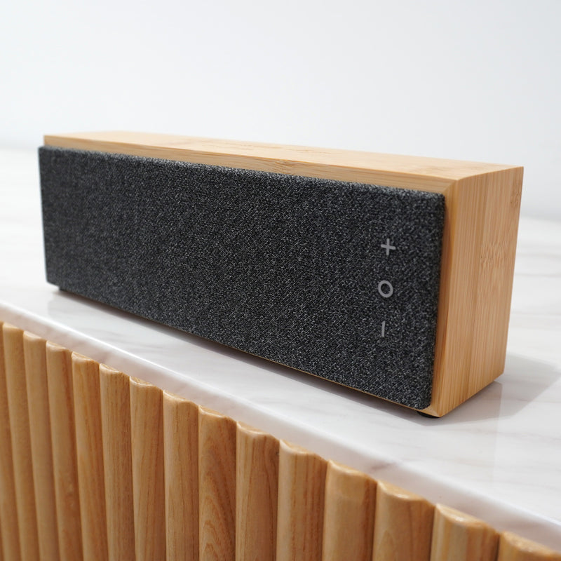 Engraved bamboo Bluetooth speaker for music lovers, featuring wireless connectivity and premium sound.