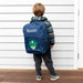 Young child wearing a personalised dinosaur backpack, showcasing the comfortable fit and playful design perfect for preschool.