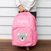 Child holding pink koala backpack with front pocket print and side mesh detail.
