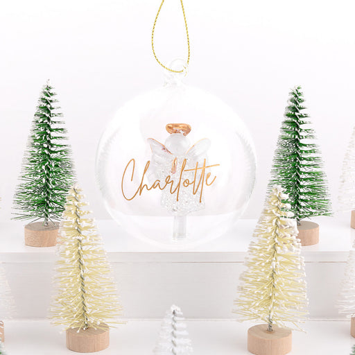 Personalised glass Christmas bauble with engraved name and angel inside featuring a gold halo