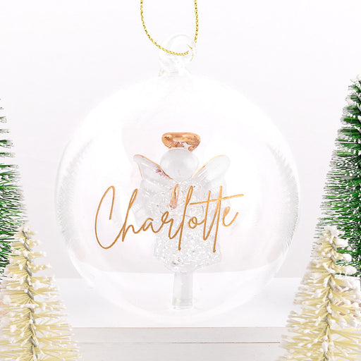 Glass ornament with delicate angel and gold hanging loop, ideal for meaningful gifting