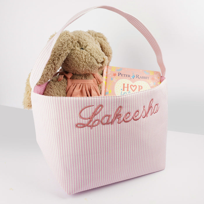 Pink Easter basket with sturdy handle, perfect for egg hunts and hampers.