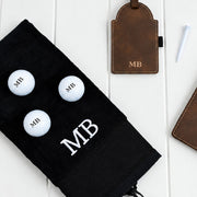 Personalised golf accessory gift set with initialled score card holder, golf tee tag, golf balls and cotton towel