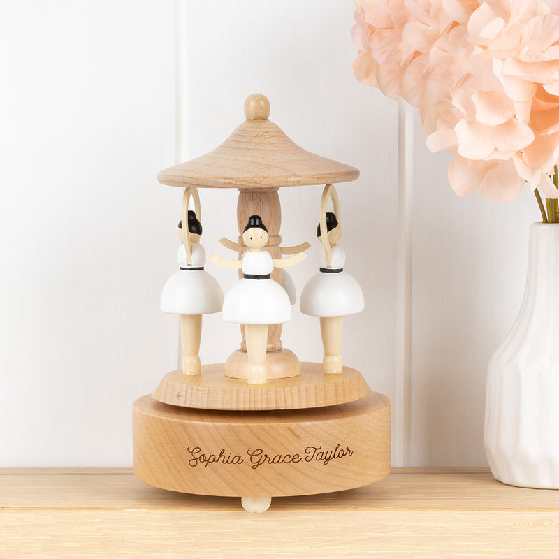 Personalised wooden musical ballerina carousel made from beech wood with spinning ballerinas and engraved name detail