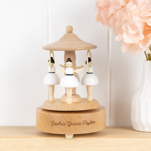 Personalised wooden musical ballerina carousel made from beech wood with spinning ballerinas and engraved name detail