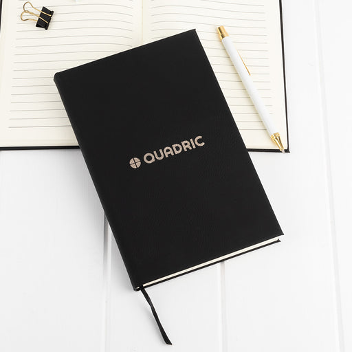 Custom A5 black leatherette notebook with gold engraved company logo