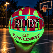 Personalised Spalding Pink Multi Marble Glow Basketball featuring a glow-in-the-dark design that lights up in the dark.