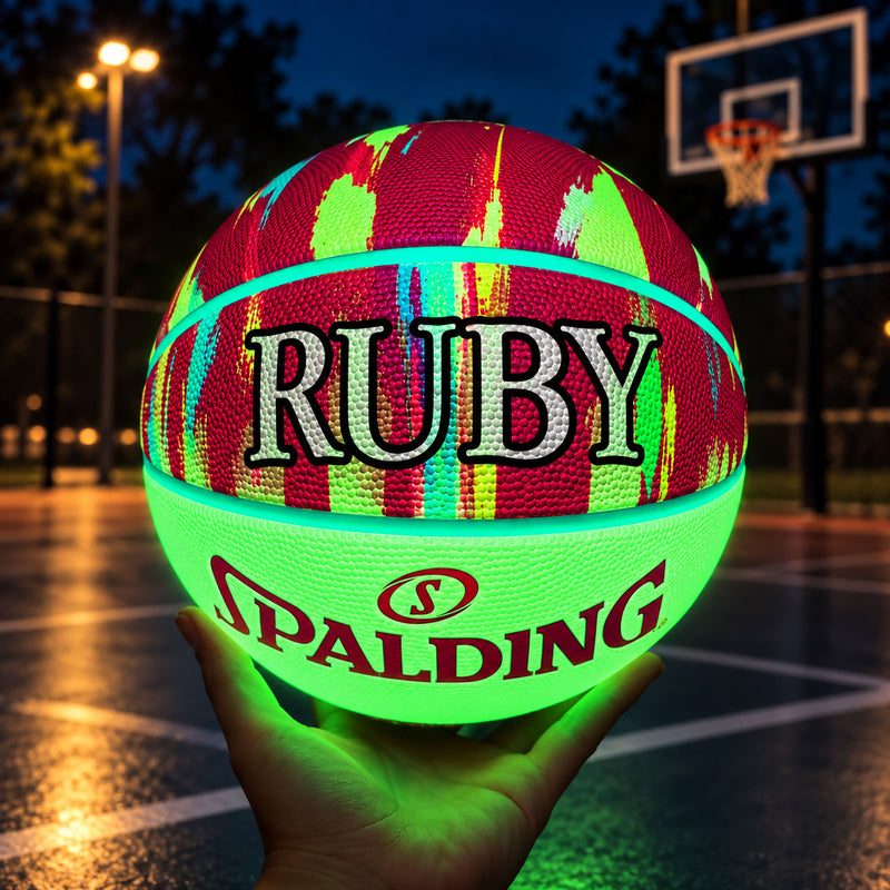 Personalised Spalding Pink Multi Marble Glow Basketball featuring a glow-in-the-dark design that lights up in the dark.