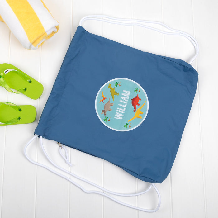 Personalised water-resistant kids swim bag with flip-flops and towel.
