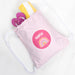 Personalised pink kids swim bag with rainbow design and child's name printed on front.