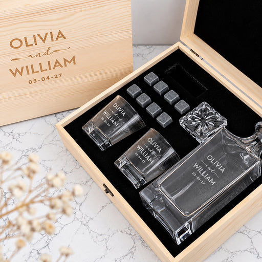 Engraved wedding decanter set personalised with the couple’s names and wedding date, complete with matching whiskey glasses and chilling stones.