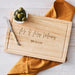 Personalised rectangular wooden cheese board with engraved anniversary design.