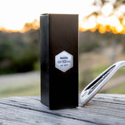 Set of three custom golf balls with initials, presented in a sleek black box – ideal for golf-themed birthday gifting.