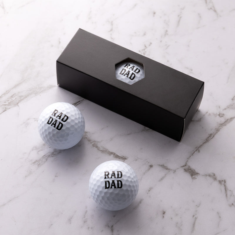 Rad Dad golf ball gift set with three printed golf balls in a black gift box, perfect for Father's Day.