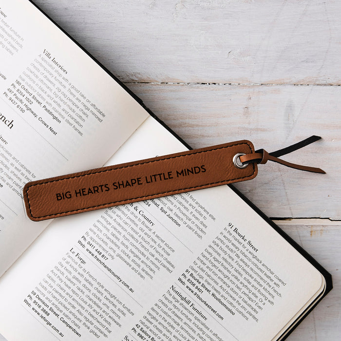 Leatherette bookmark engraved with “Big Hearts Shape Little Minds” in Tan colour