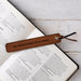 Leatherette bookmark engraved with “Big Hearts Shape Little Minds” in Tan colour