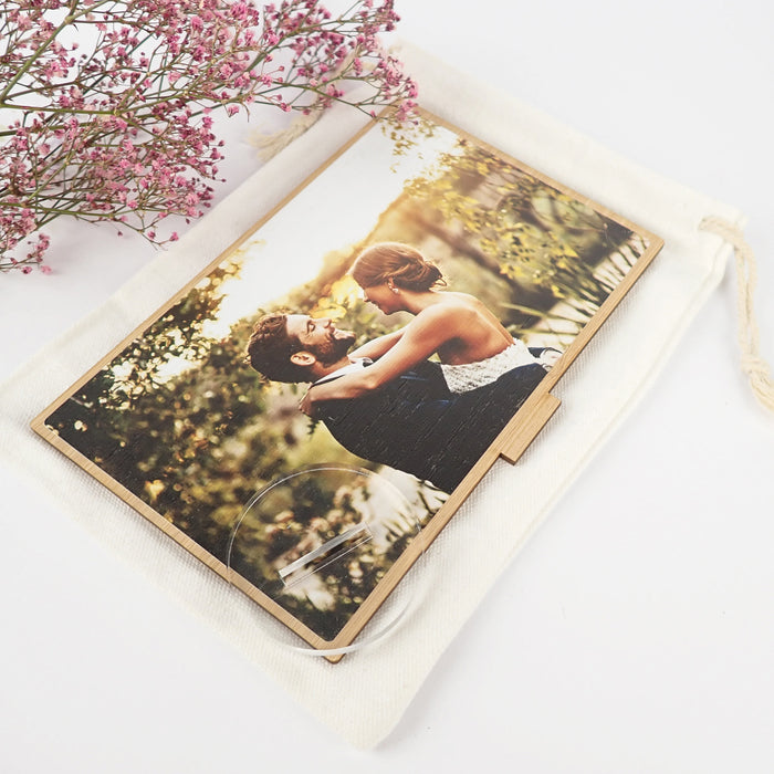 Treasured wedding photo moments saved on a customised printed bamboo frame.