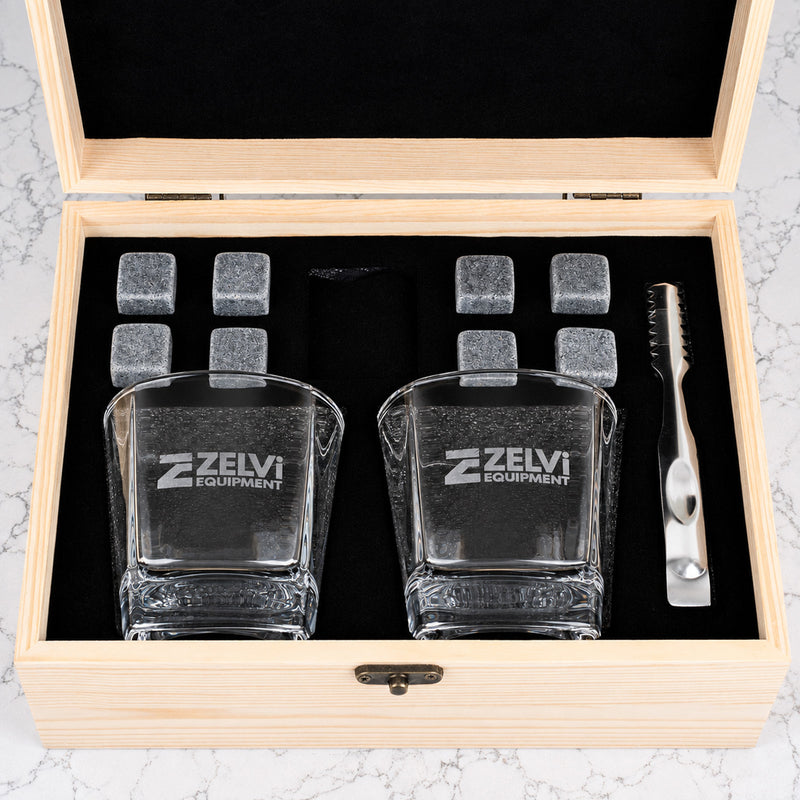 Premium corporate whiskey set with personalised glasses, whiskey stones and company logo engraved on a wooden gift box for clients and executives.