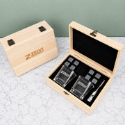 Branded whiskey gift set with square whiskey glasses, reusable stones, stainless steel tongs and personalised wooden box for corporate gifting.