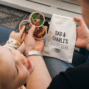 Custom bamboo memory game with 12 photo tiles and keepsake storage bag