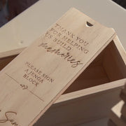 Wooden tumbling tower game with engraved box