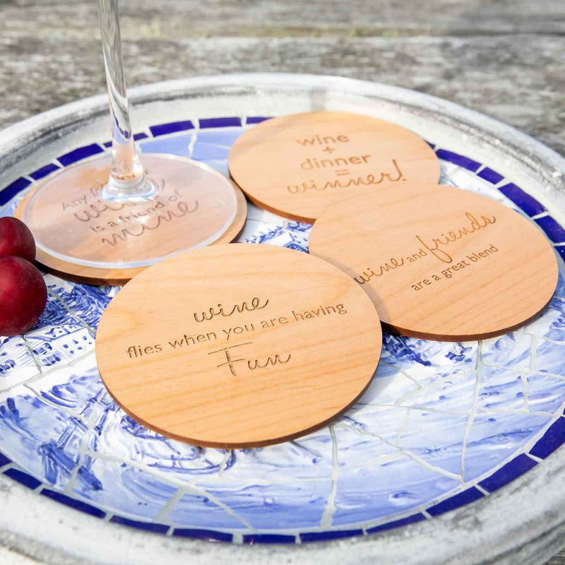 Customised wooden coasters engraved with wine sayings for birthday gift